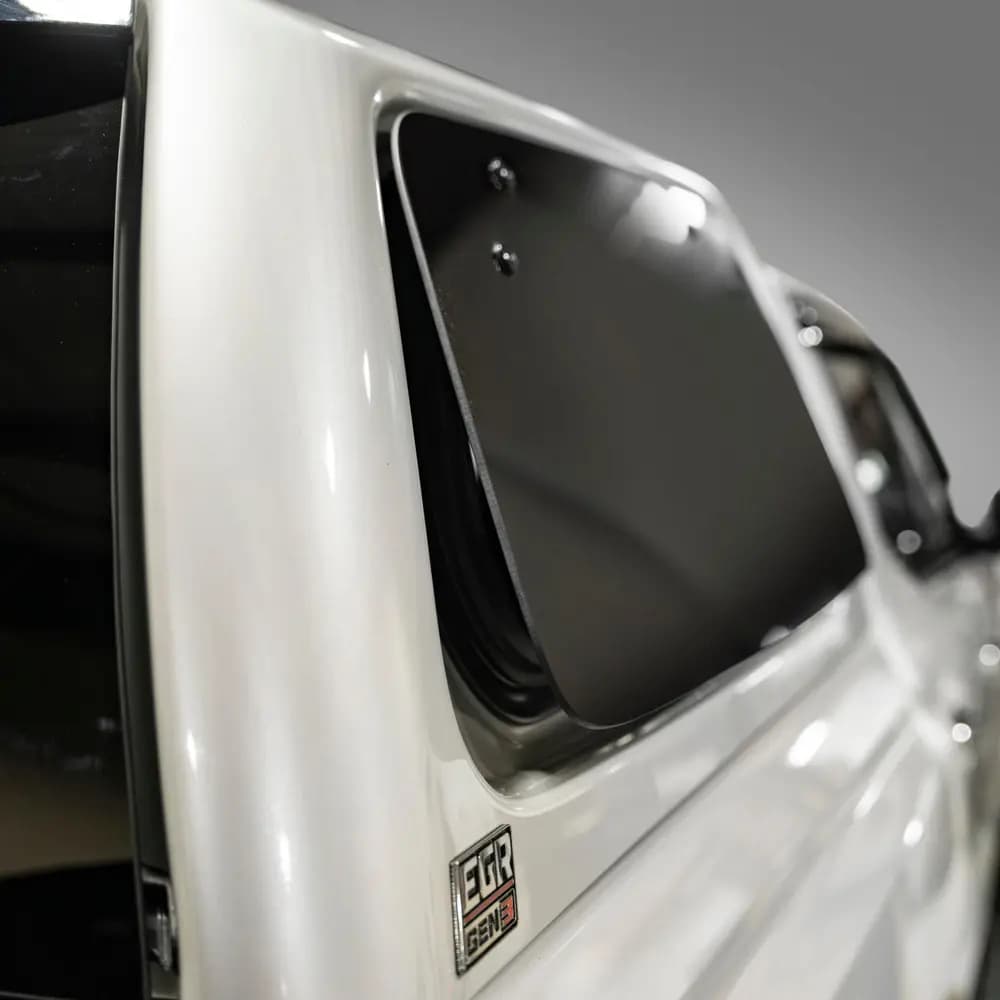 Close-up of a white EGR GEN3 Canopy showing the frameless pop-out window and EGR GEN3 badge