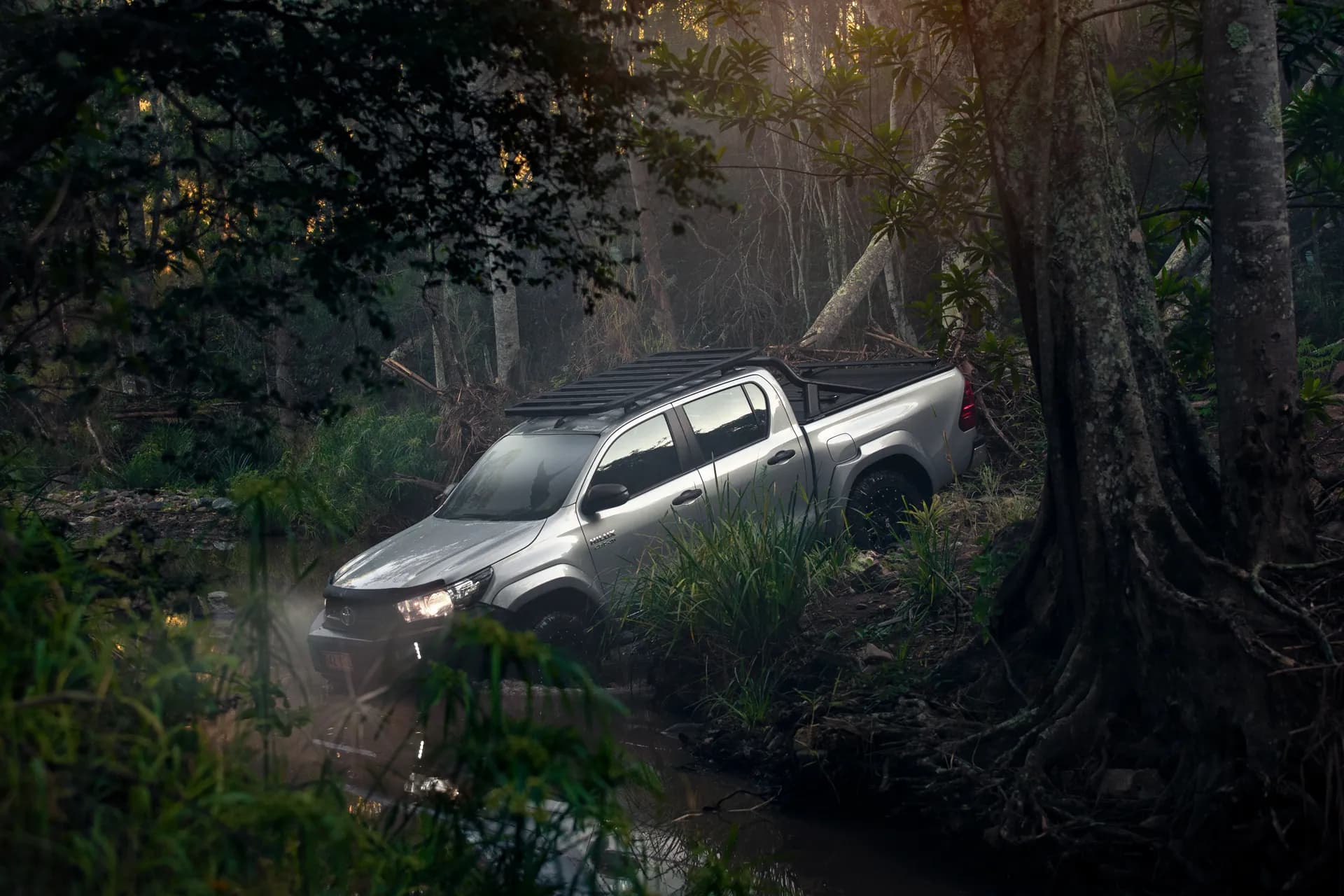 Truck or ute with EGR canopy parked alongside a stone or brick wall