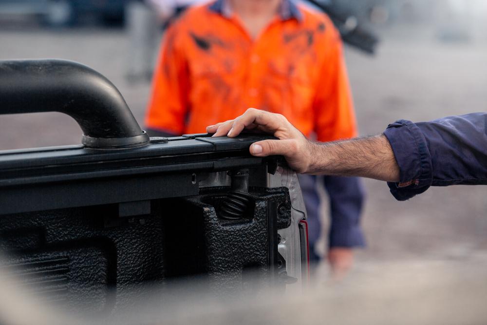 man operating EGR Rolltrac with the electric rolltrac's push button