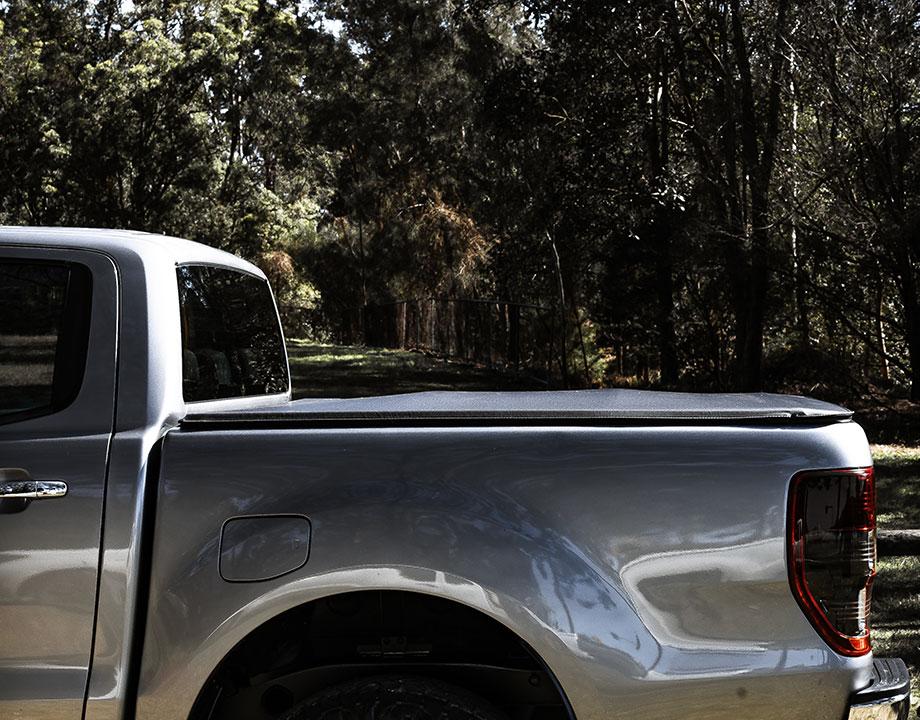 egr soft tonneau cover installed on a ute parked in a park