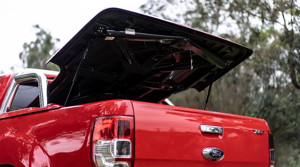 red ford ute with an open egr hard lid