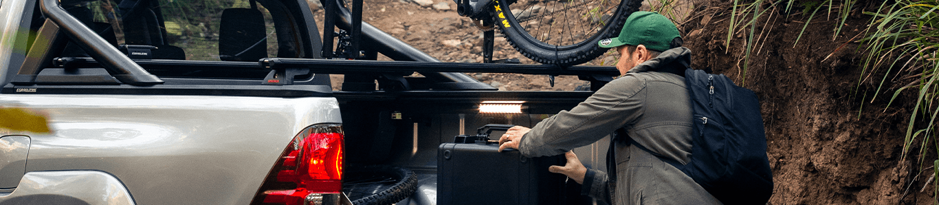 man loading items into a ute tray