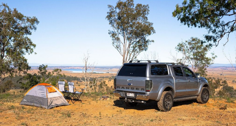 Family camping setup with EGR canopy on a ute