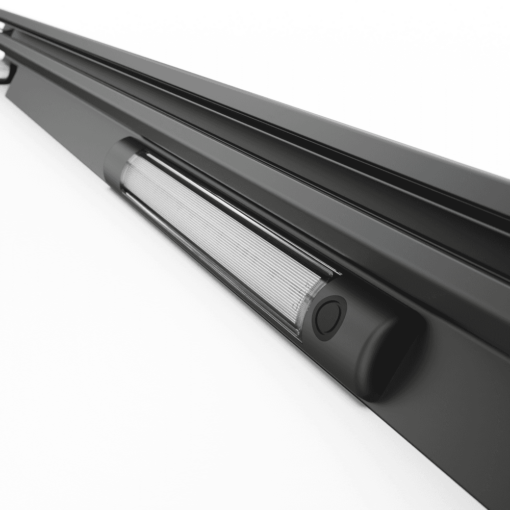 Volkswagen Amarok RollTrac RH electric side rail installed view showing alignment with canister and smooth tonneau track system.