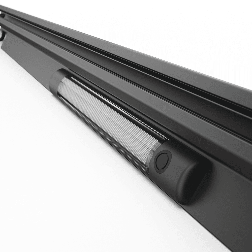 Close-up of EGR RollTrac aluminium right-hand side rail channel for Nissan Navara 2015 electric tonneau cover alignment and secure installation.