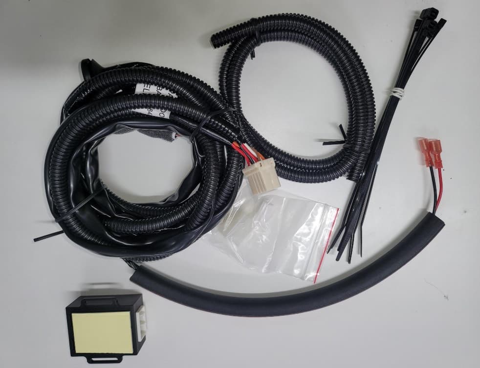 EGR vehicle wiring harness for Toyota Hilux 2005–2014 Premium Canopy, showing wiring loom, connectors, conduit tubing, control module, and cable ties for canopy electrical integration