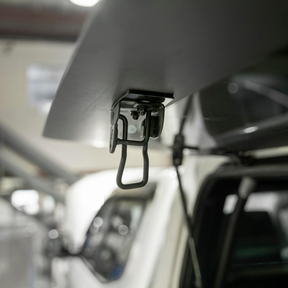 Close-up of EGR Gen3 canopy lift window stay mechanism inside canopy, showing secure latch holding window partially open