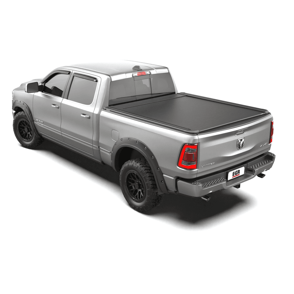 Side angle of RAM DT 1500 with EGR RollTrac Electric E3 tonneau cover, demonstrating sleek fit, T-rail compatibility, and premium finish