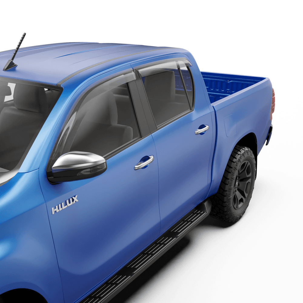 Close-up of EGR Slimline Weather Shield on Toyota Hilux door, showing slim acrylic visor and flush fitment