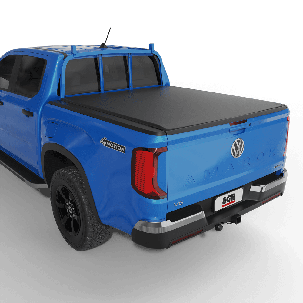 Volkswagen Amarok NF with EGR soft tonneau cover fitted, showing matte black low-profile tub cover from rear angle