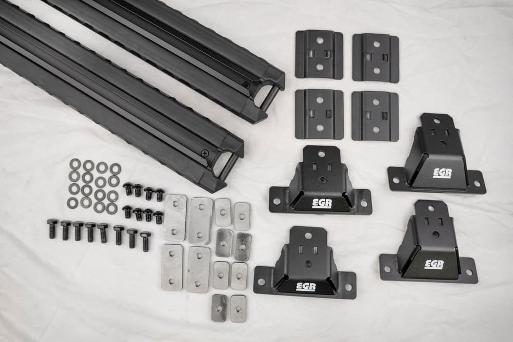 EGR GEN3 canopy crossbar kit components and mounting hardware laid out for installation