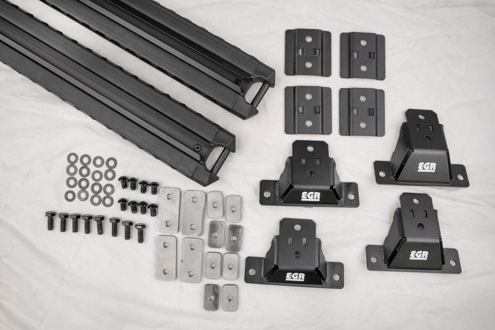 EGR GEN3 canopy crossbar kit components and mounting hardware laid out for installation