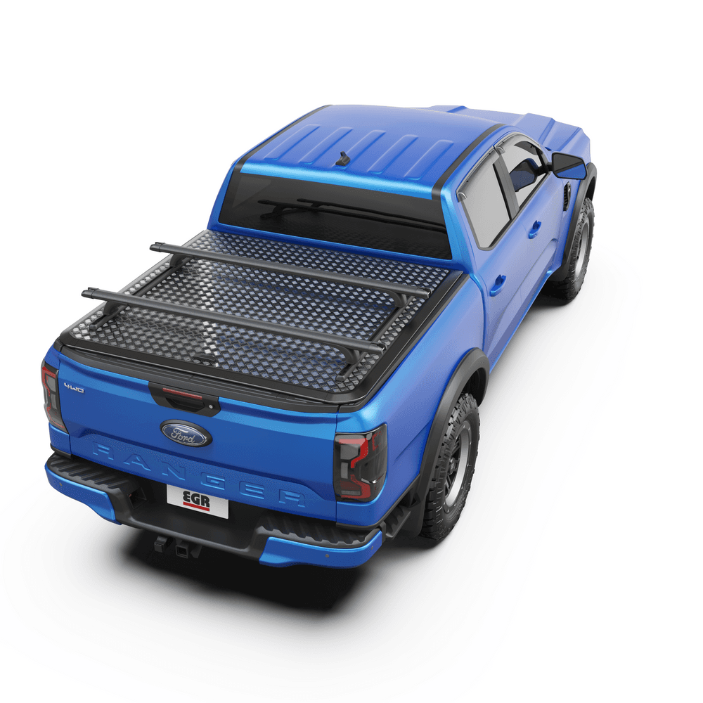 Top-down view of blue ute tub with EGR RollTrac Crossbars mounted securely over RollTrac cover