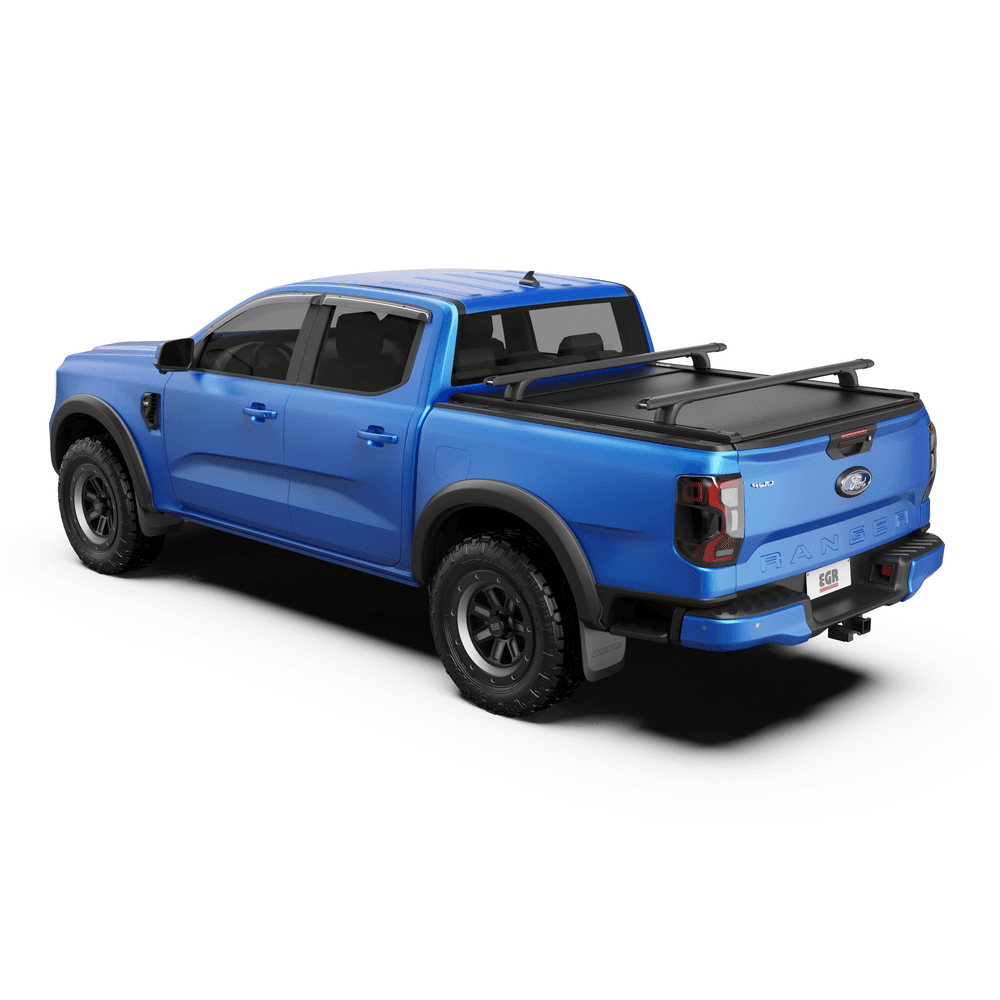 Blue ute with EGR RollTrac Crossbar Kit installed, showing crossbars mounted across tub for carrying gear