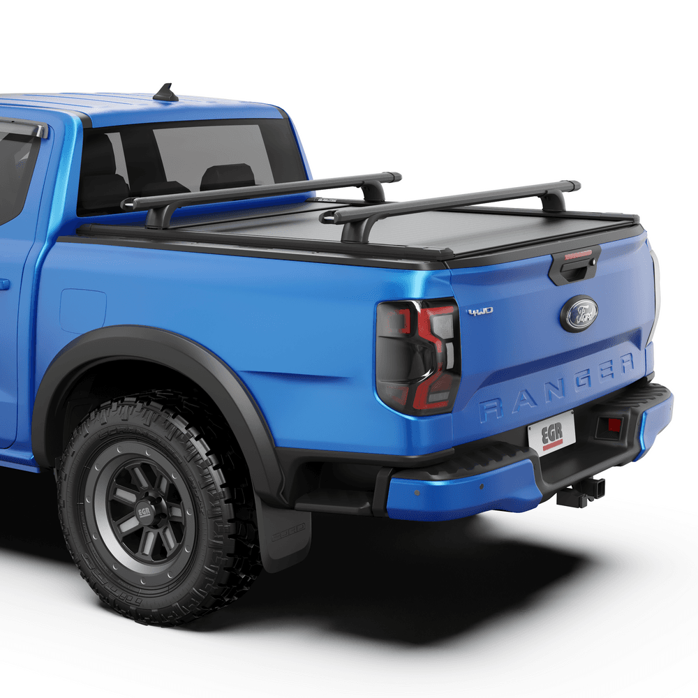 Close-up of EGR RollTrac Crossbar Kit mounted on RollTrac side rails with integrated tie-down points