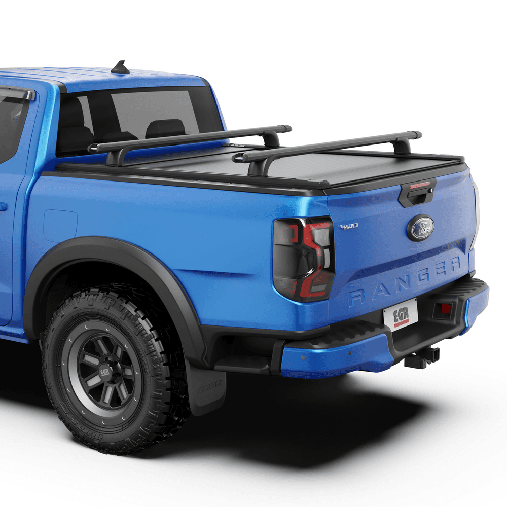 Close-up of EGR RollTrac Crossbar Kit mounted on RollTrac side rails with integrated tie-down points