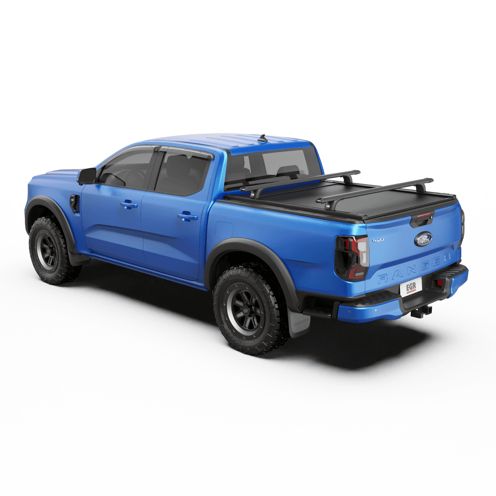 Blue ute with EGR RollTrac Crossbar Kit installed, showing crossbars mounted across tub for carrying gear