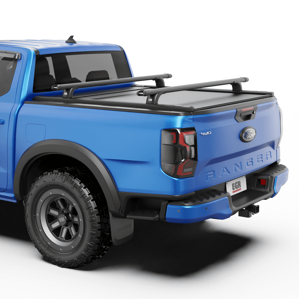 Close-up of EGR RollTrac Crossbar Kit mounted on RollTrac side rails with integrated tie-down points