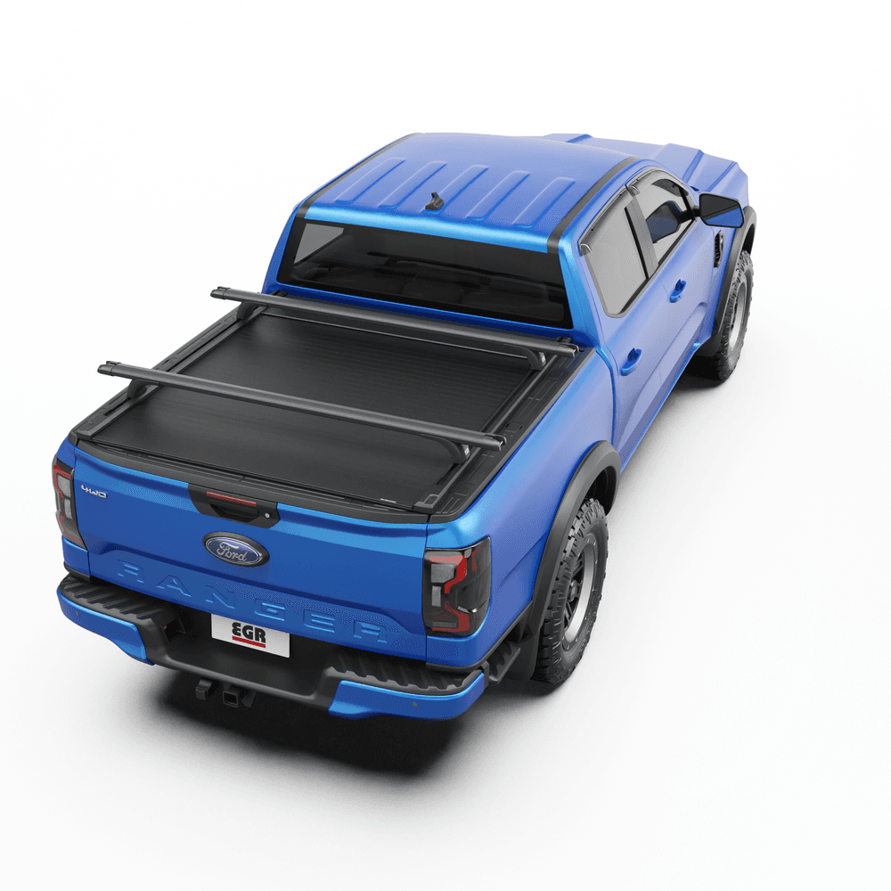 Top-down view of blue ute tub with EGR RollTrac Crossbars mounted securely over RollTrac cover