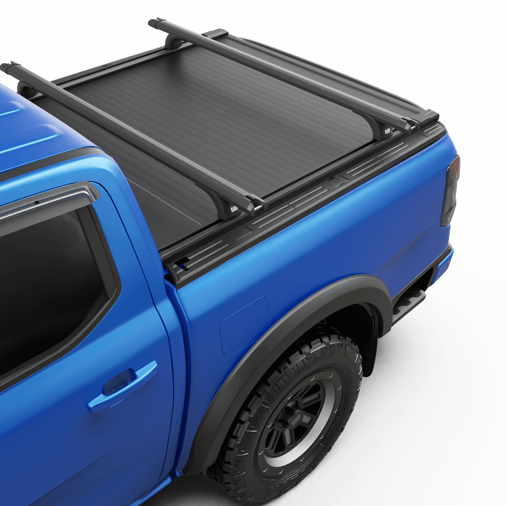 Detail view of black powder-coated RollTrac crossbar showing steel construction and mounting brackets