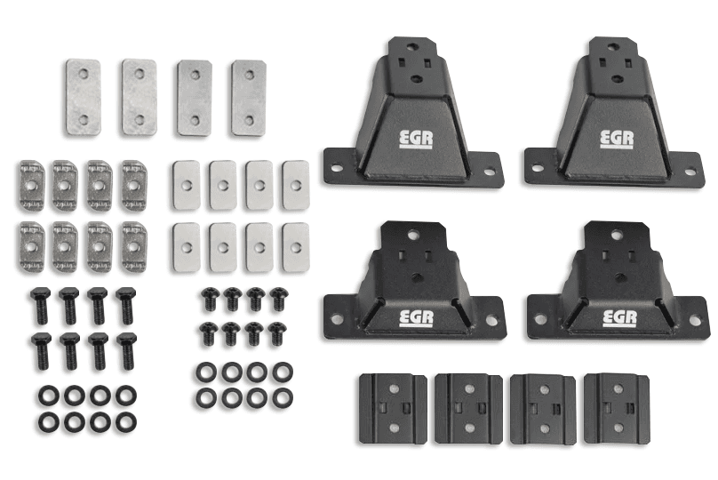 EGR GEN3 Canopy Leg Kit ST showing mounting legs, brackets, adapter plates, bolts, and hardware for supporting crossbars on an EGR GEN3 canopy