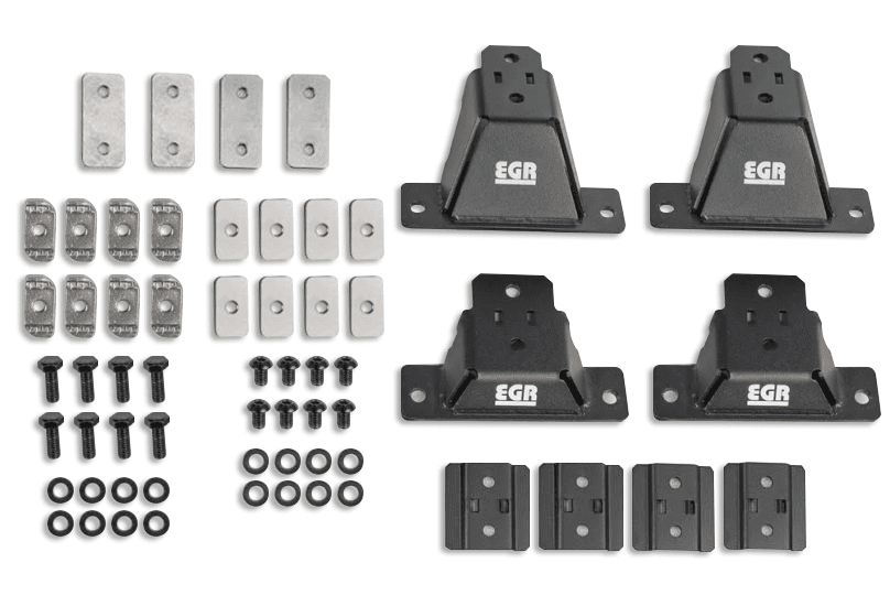 EGR GEN3 Canopy Leg Kit ST showing mounting legs, brackets, adapter plates, bolts, and hardware for supporting crossbars on an EGR GEN3 canopy