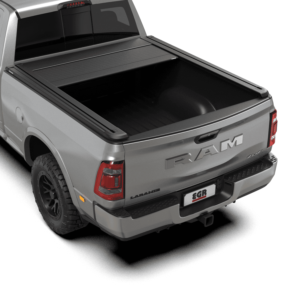 EGR RollTrac Electric E3 tonneau cover partially open on RAM DJ 3500, showing electric rolling operation