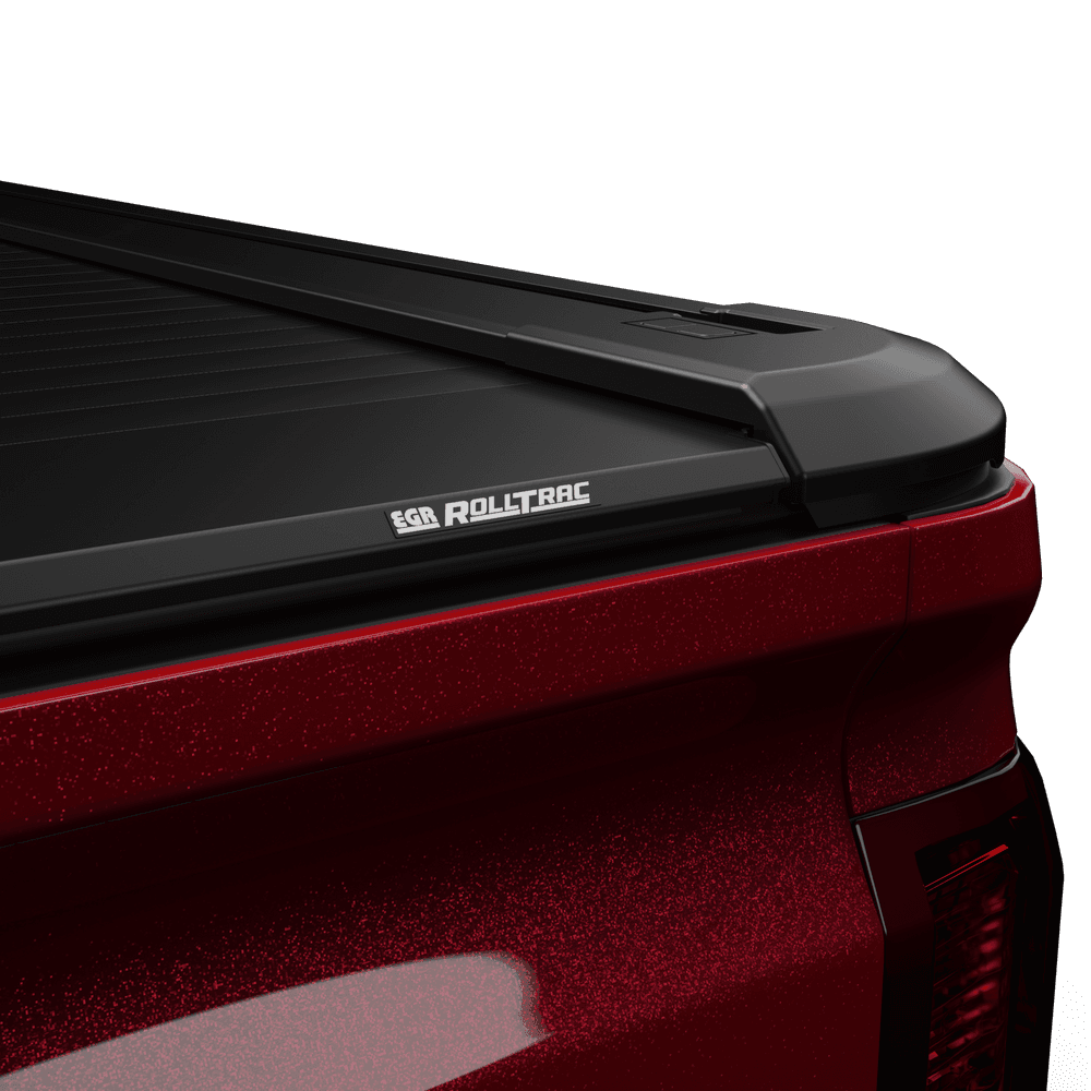 Close-up of EGR RollTrac Electric E3 tonneau cover side rail and black powder-coated aluminium slats on Silverado 2500