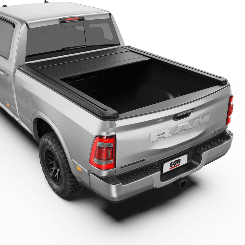 Side angle showing EGR RollTrac Manual tonneau cover installed on RAM DJ 2500 tray