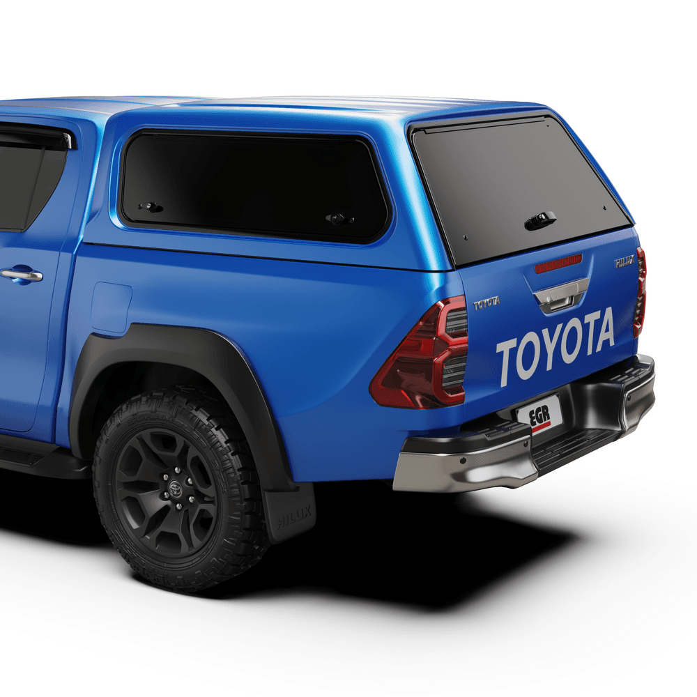 Rear three-quarter view of Toyota Hilux fitted with EGR Core Canopy, showing tinted rear window and OEM-style finish