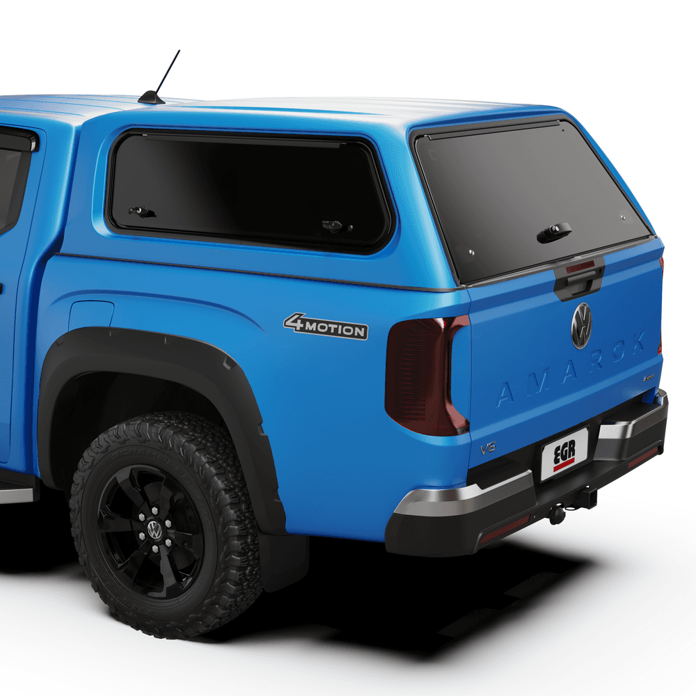 Rear three-quarter view of blue Volkswagen Amarok NF fitted with EGR Core Canopy, showcasing tinted windows and seamless OEM-style finish