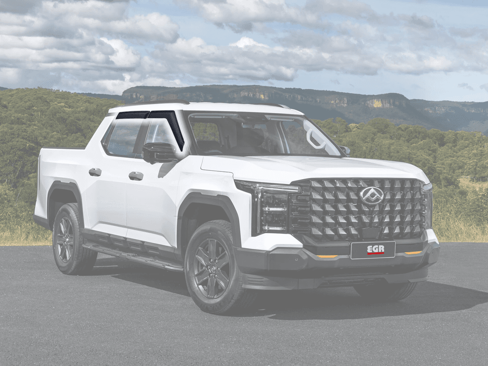 Front side view of white Ute featuring EGR matte black Slimline Weather Shields