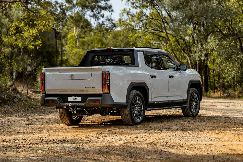 Side view of white Ute fitted with EGR Slimline Weather Shields in matte black
