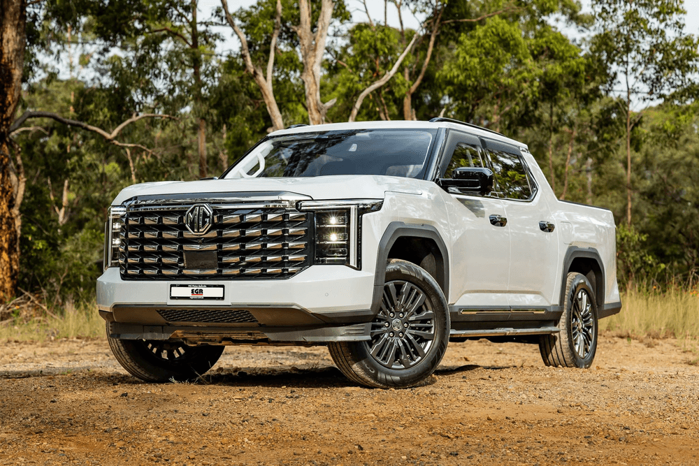 White Ute fitted with EGR matte black Slimline Weather Shields on an off-road track