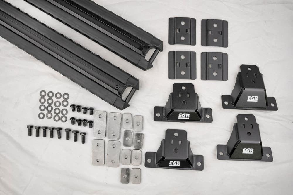 EGR GEN3 canopy crossbar rack kit hardware components including mounting legs, brackets, bolts, and fittings