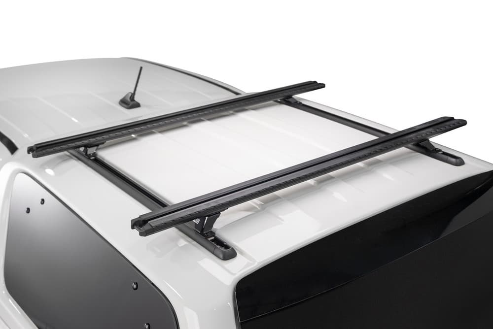 Close-up of Yakima TrimHD crossbar mounted to EGR Gen3 canopy track rails using staggered-height leg system
