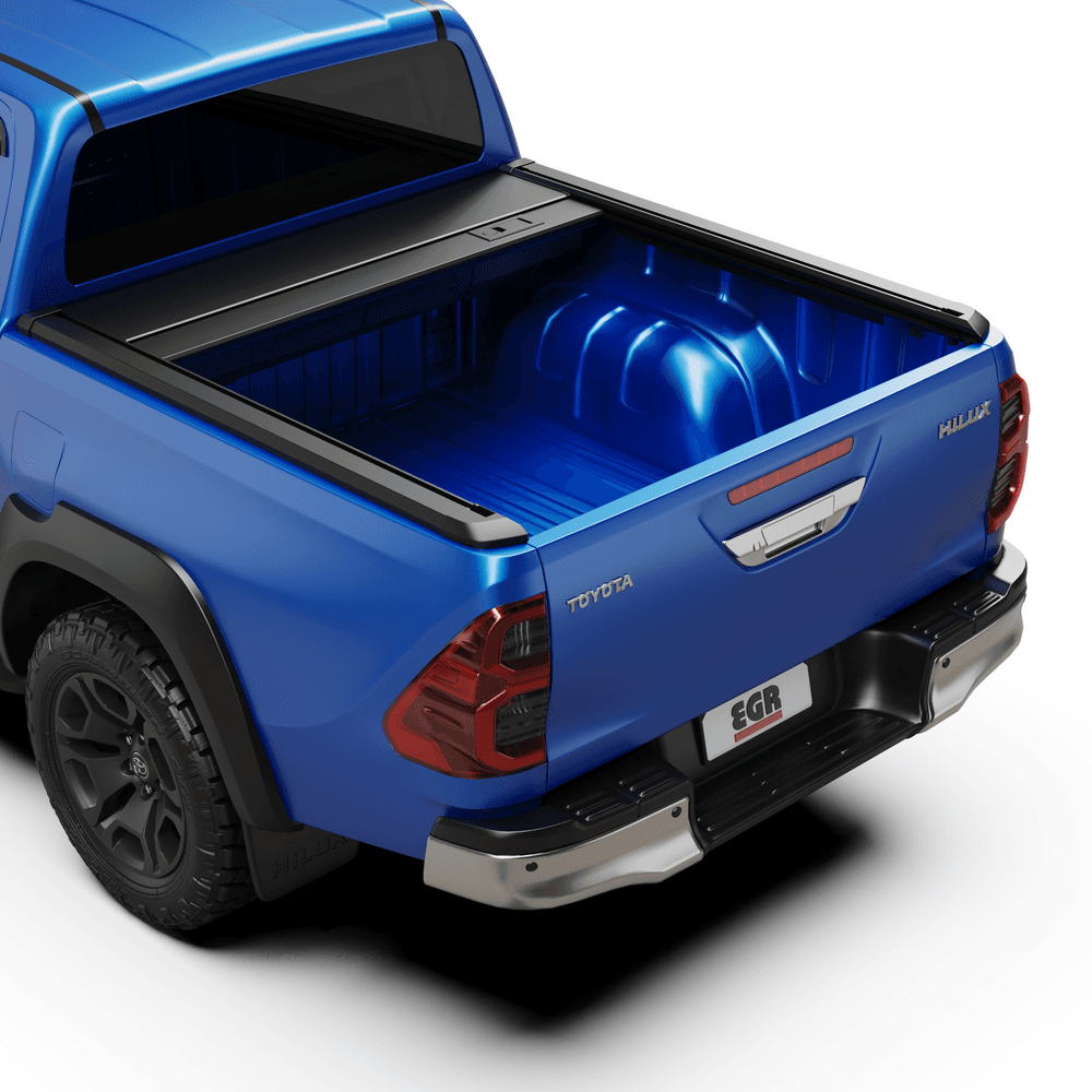 Rear angle of a Toyota Hilux 2015–2020 featuring the EGR Auto RollTrac Manual Roller Cover fully open