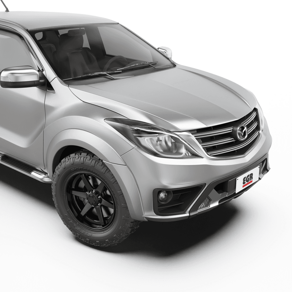 Front three-quarter view of a Mazda BT-50 with EGR Fender Flares installed, showcasing the rugged styling and enhanced wheel arch protection