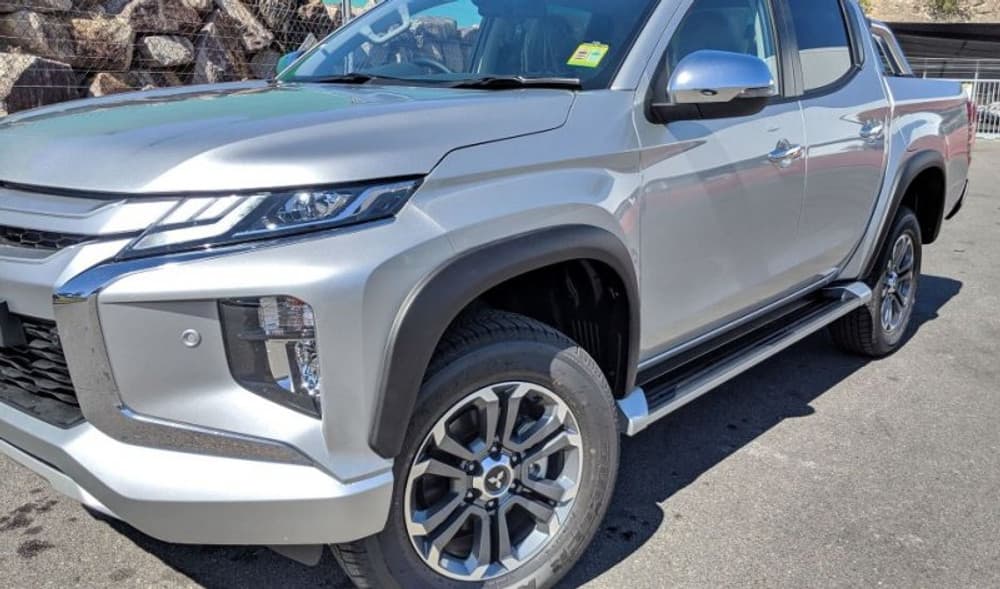 Side-angle view of Mitsubishi Triton MR upgraded with EGR Fender Flares, offering a tougher, wider stance