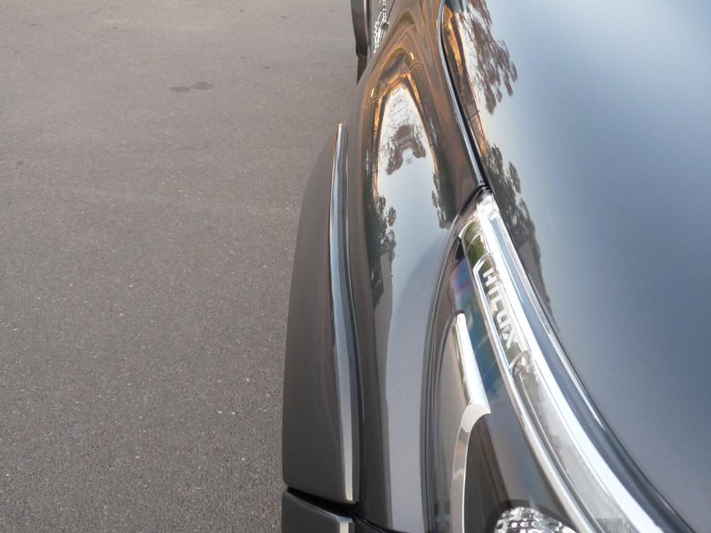 Detailed close-up of Toyota Hilux fender flare mounting edge and bodyline alignment