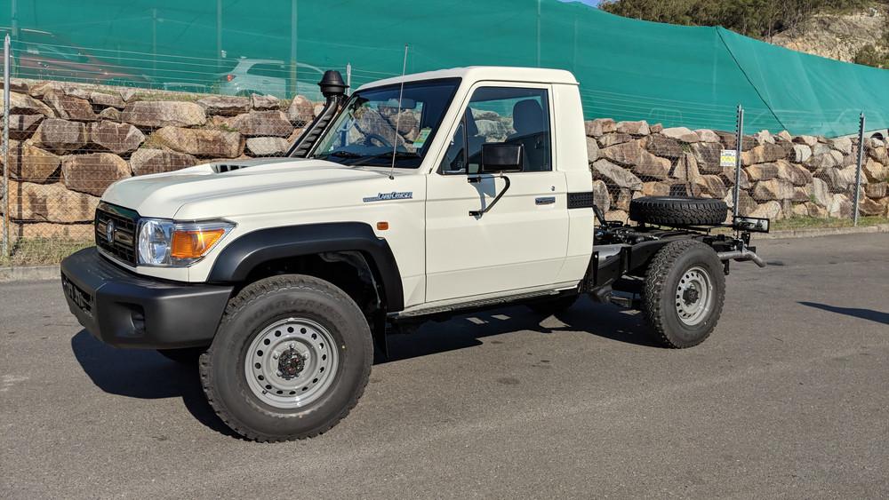 White Toyota LandCruiser 70 Series single cab Ute with EGR Fender Flares installed, highlighting the rugged off-road stance and added mud and debris protection