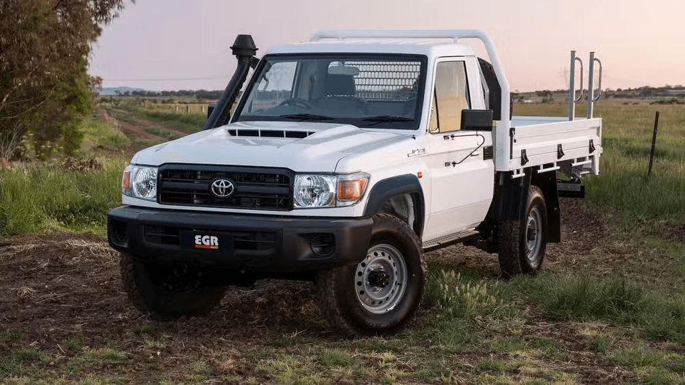 Toyota LandCruiser 70 Series single cab Ute with black EGR Fender Flares, photographed outdoors to display increased tyre coverage and toughened body styling