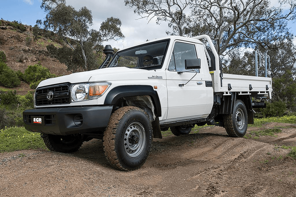 Toyota LandCruiser 70 Series Ute fitted with Ultra Matte Black EGR Fender Flares, shown in an off-road setting to emphasize enhanced protection and aggressive appearance