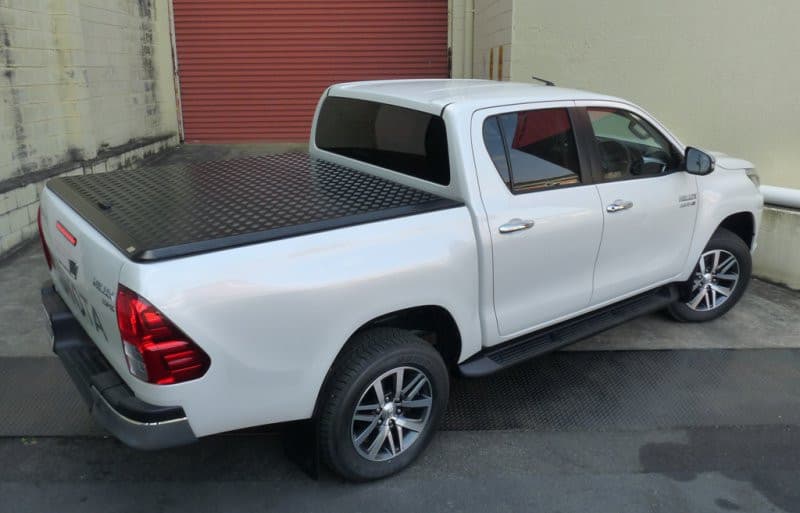 White Toyota Hilux 2015 with EGR Load Shield installed – side view of secure tub cover