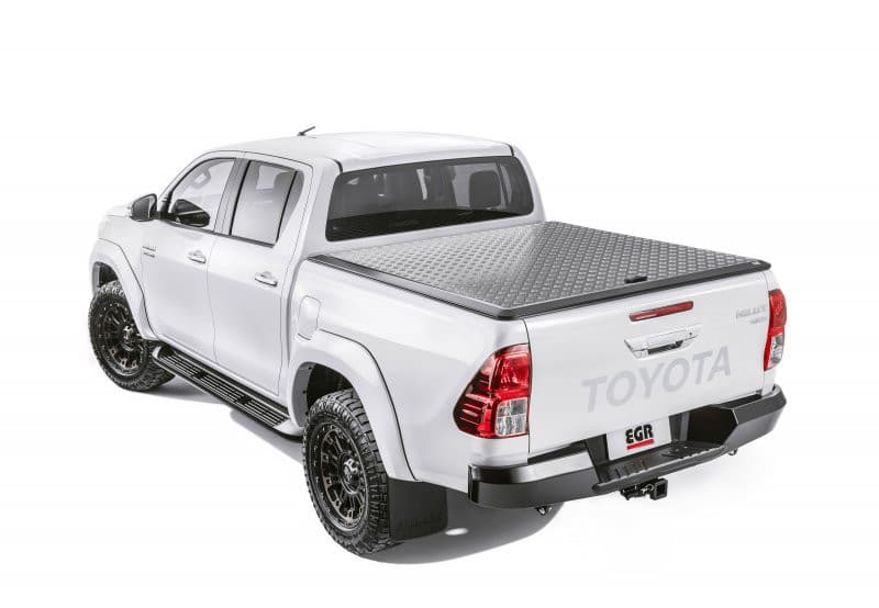 Toyota Hilux 2015 white model with EGR Load Shield – three-quarter rear view showcasing aluminium checkerplate panel