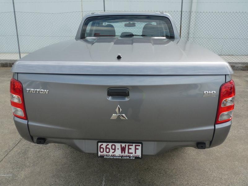 Rear angle of Mitsubishi Triton MQ/MR with EGR Hard Lid installed, showcasing secure push-button locking system