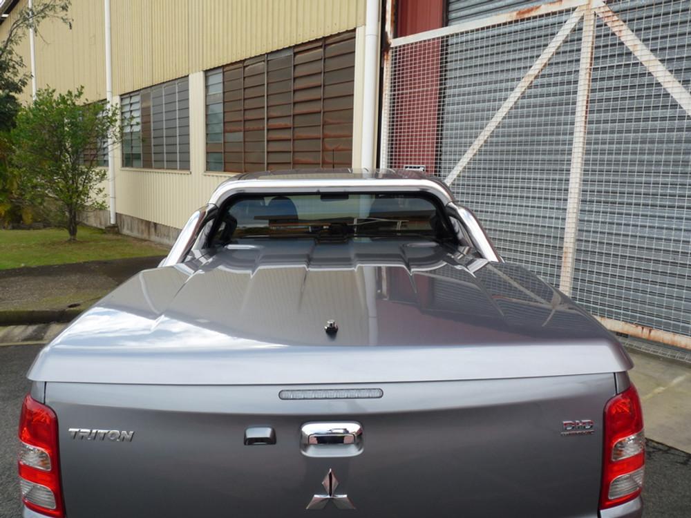 Close-up of EGR Hard Lid on red Mitsubishi Triton MQ/MR, highlighting colour-matched finish and secure fit around sports bar