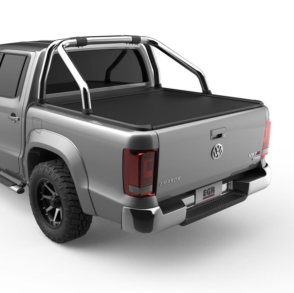 Volkswagen Amarok fitted with EGR RollTrac Sports Bar Adapter Kit, rear three-quarter view showing raised OEM polished alloy sports bar integration