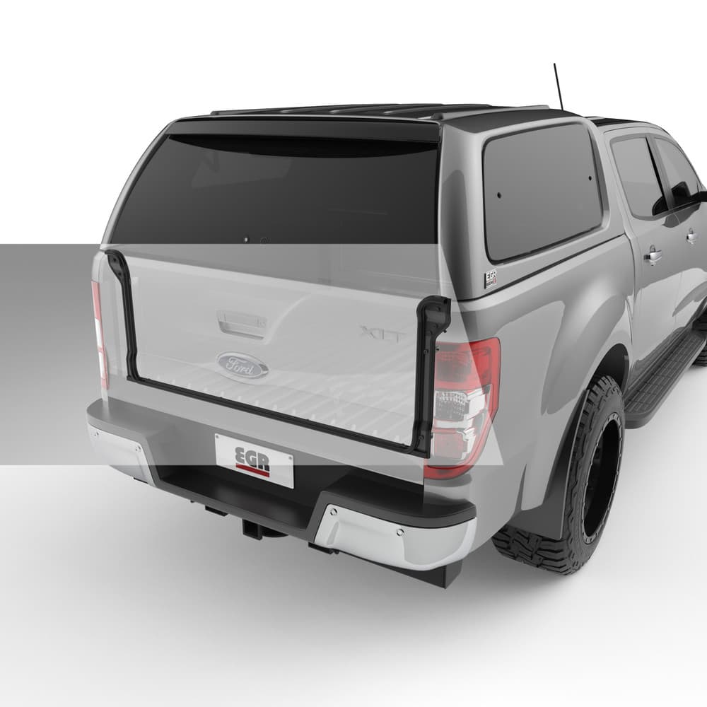 Open tailgate view of Ford Ranger PX with EGR Dust Defender installed, highlighting rubber sealing strips designed to block dust and debris