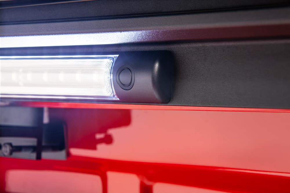 Close-up of EGR RollTrac LED Lighting Kit mounted inside electric RollTrac side rail, showing bright tub illumination